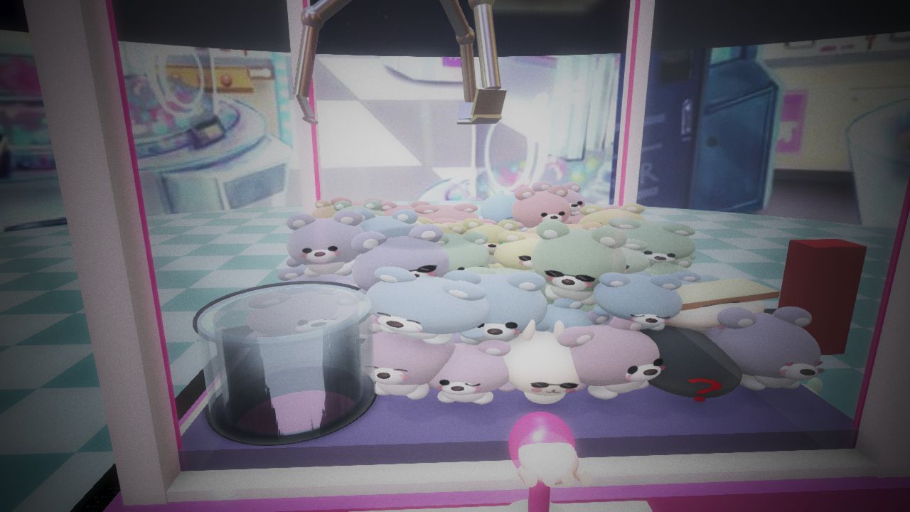クレーンのアームがぬいぐるみを掴む場面